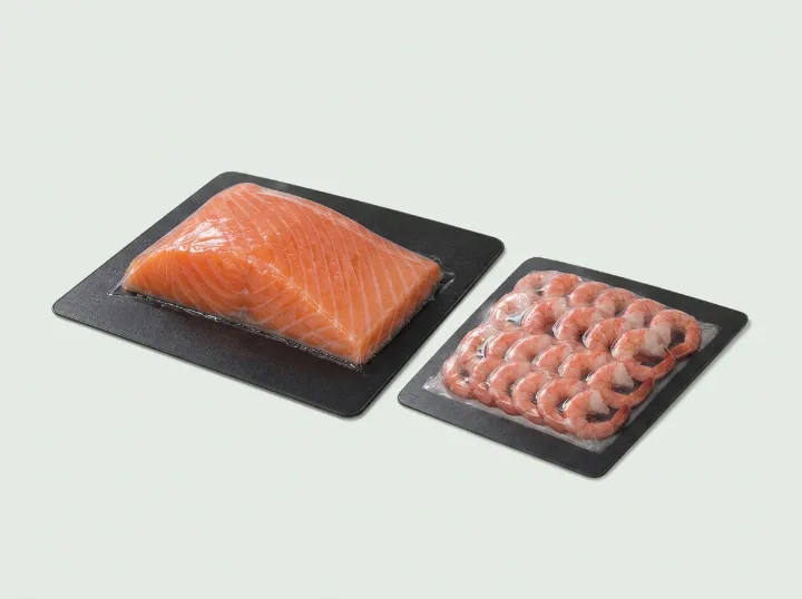 Salmon and shrimp in vacuum skin packs