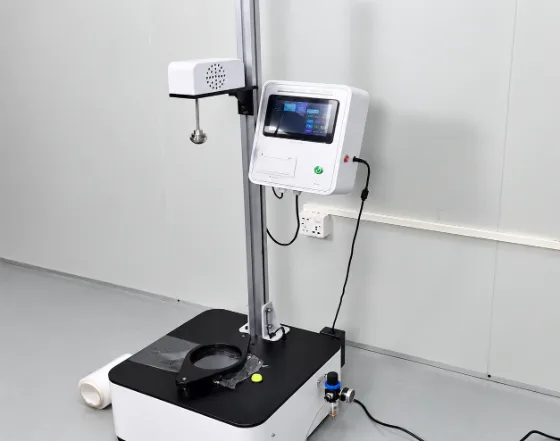 Dart impact testing machine with a film specimen clamped on the base