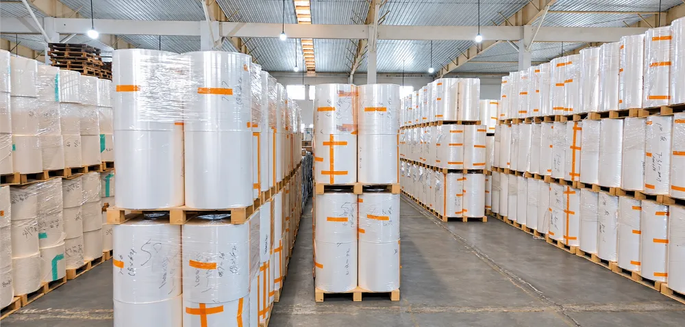 Renature warehouse with pallets of wrapped film and material rolls