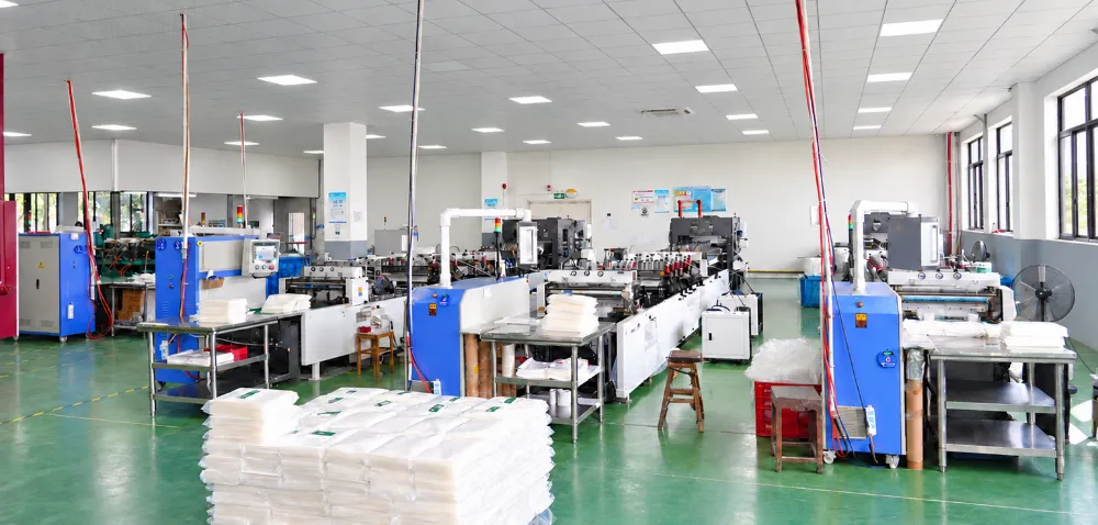 Bag-making workshop with sealing machines and in-line inspection tables