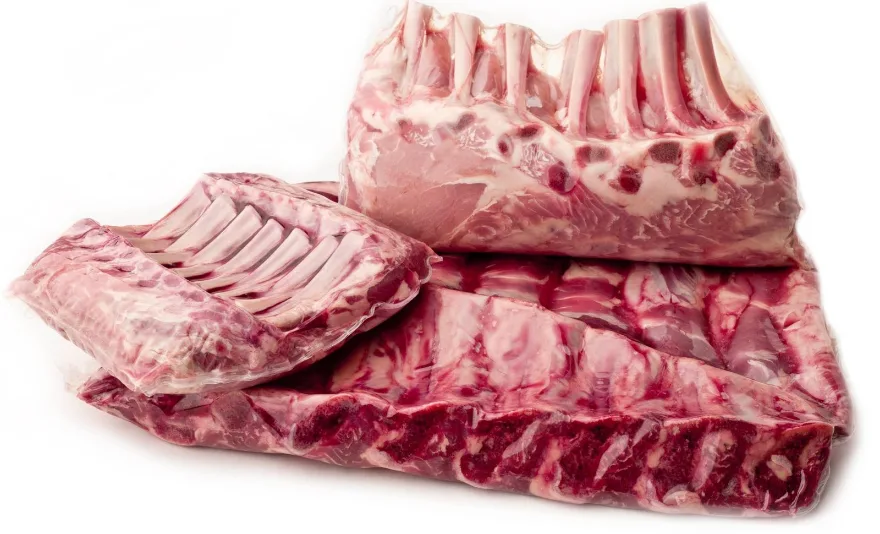 Racks of ribs and bone-in meat sealed tight in clear heat shrink bags